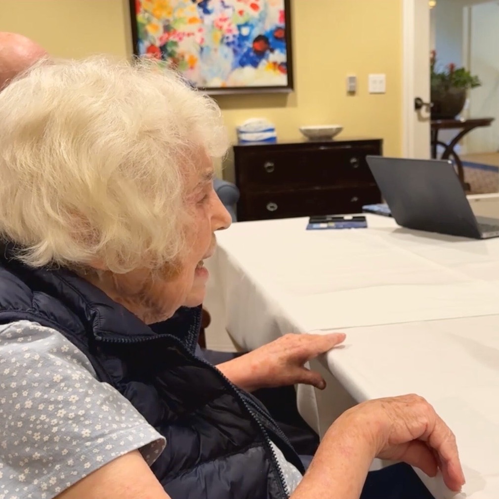 A resident at Creekview memory care chatting with MentiaCompanion